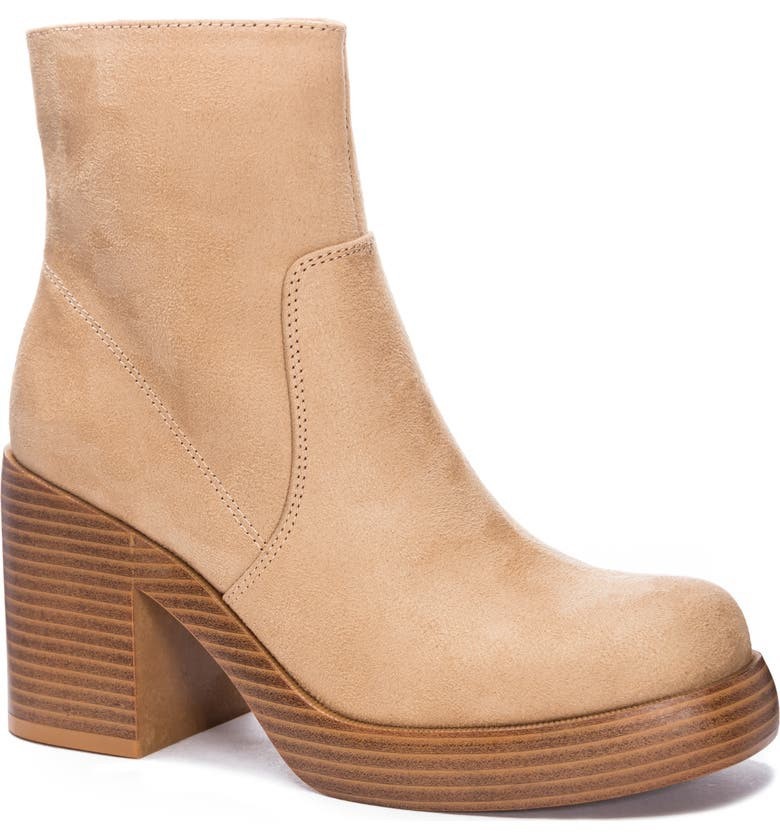 Fall Fashion Essential A chunky platform and block heel accentuate the '70s-inspired style of a take-charge boot with a rounded toe.